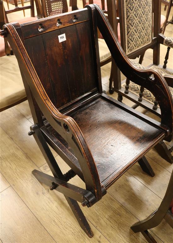 A carved oak church chair